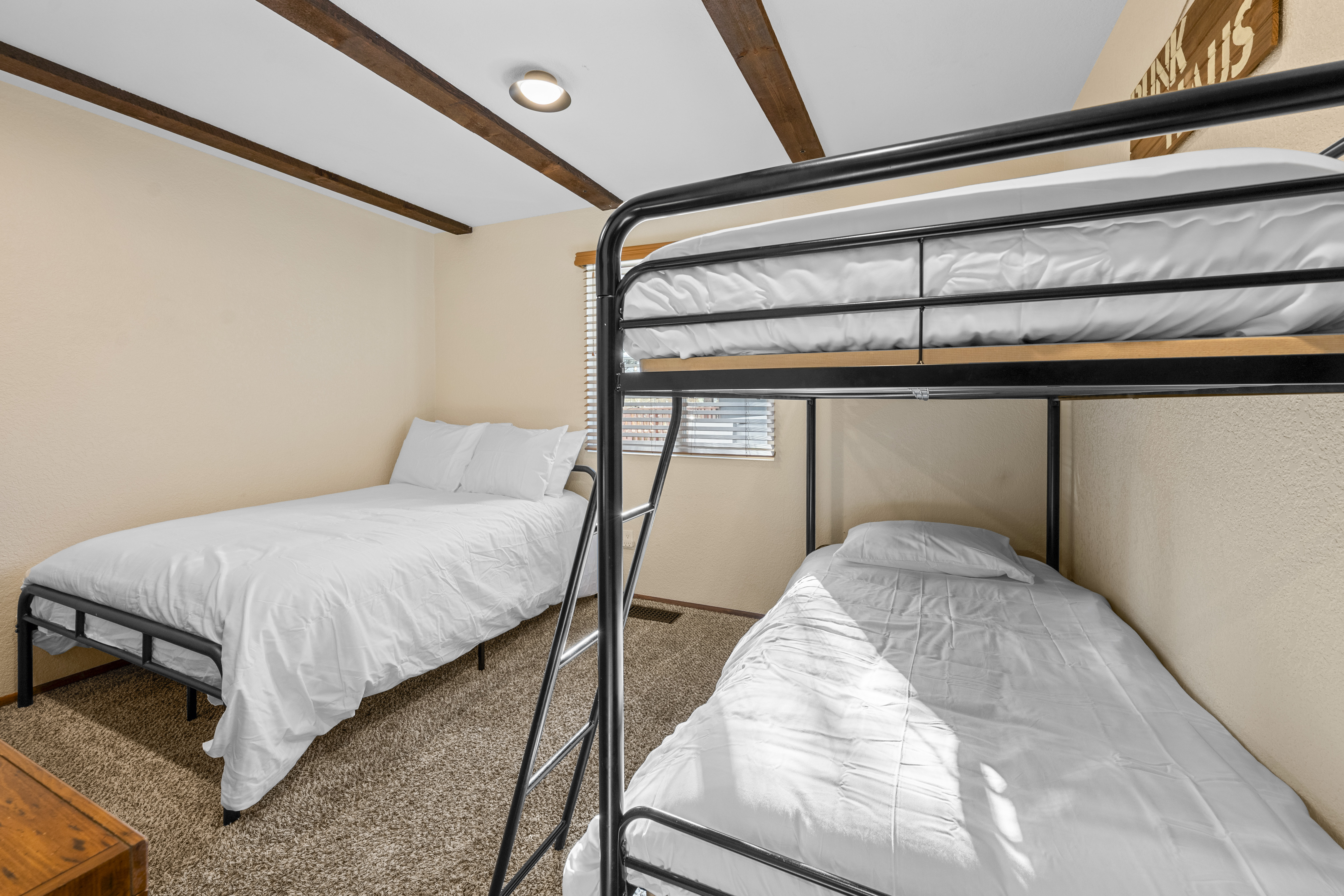 Bunk room at Bear View Escape with a twin-over-twin bunk and a full bed